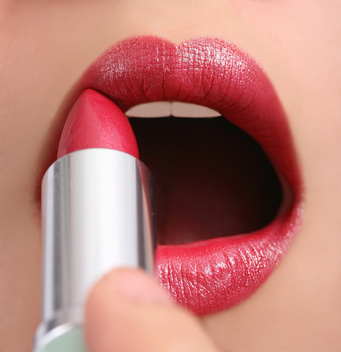 Applying lipstick
