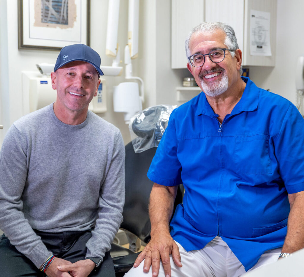 Dr. Michael Sinkin DDS MAGD with a patient at his Midtown Manhattan dental practice