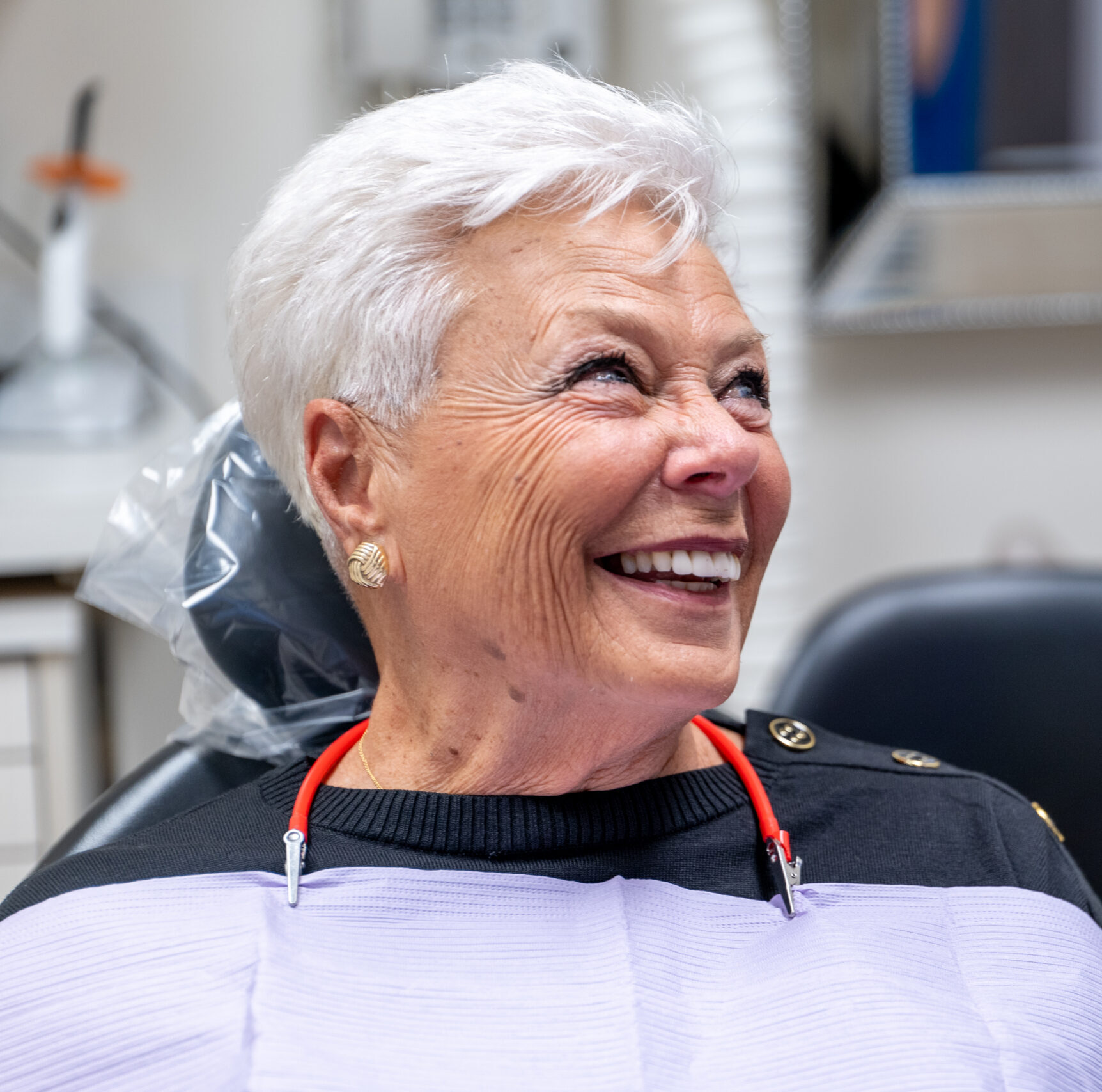 Smiling patient after All-On-4 and All-On-X dental implant treatment in Midtown Manhattan