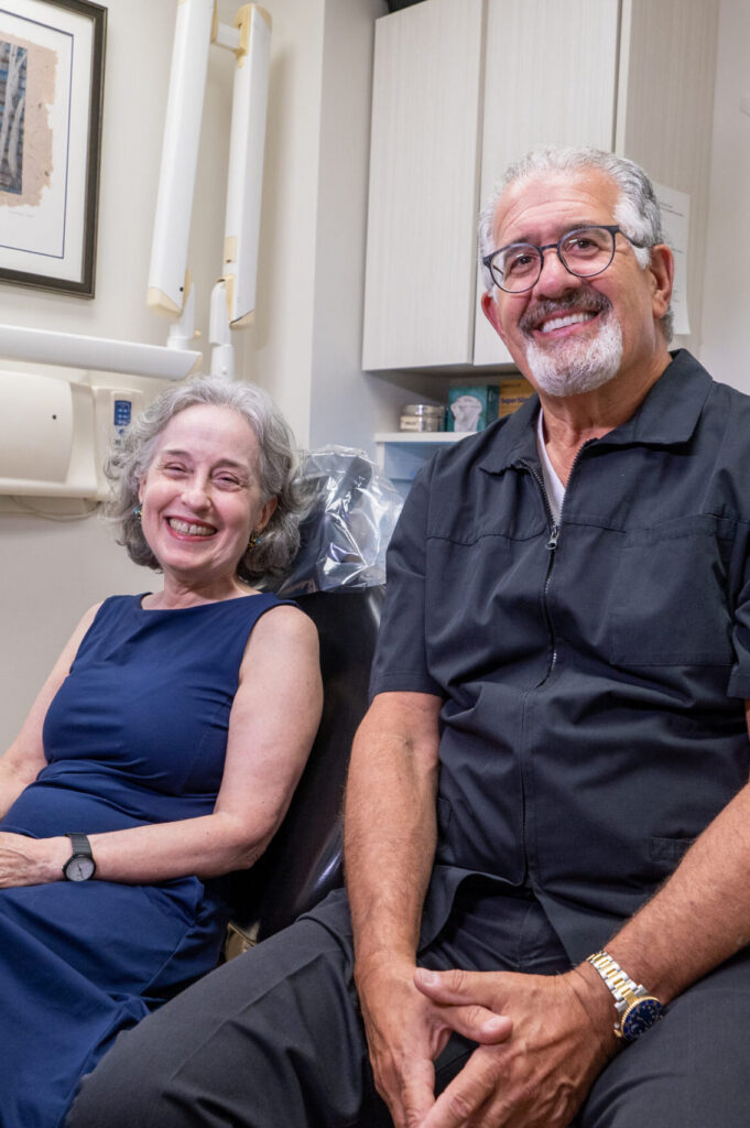 Dr Sinkin and his patient smiling in his Manhattan office