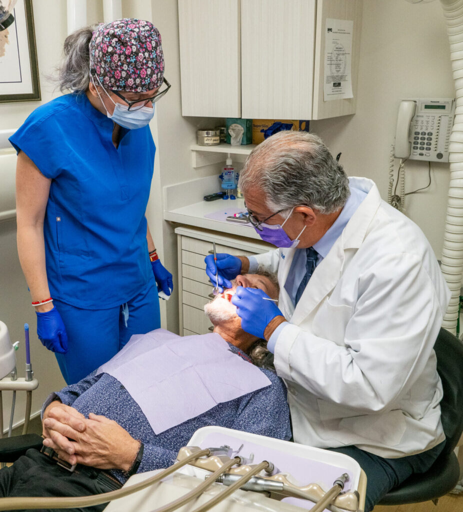 Dr. Michael Sinkin performing in-house dental implant treatment at his Manhattan practice