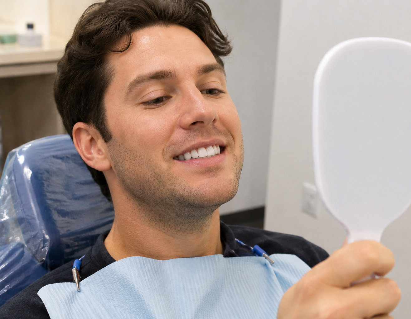 Man smiling after dental bonding treatment at a Midtown Manhattan dental office